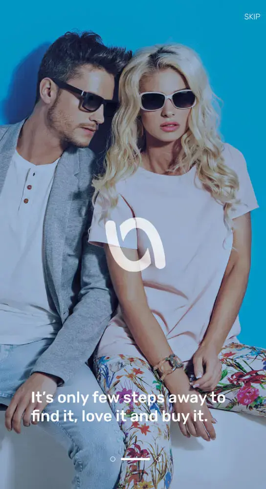 A stylish man and woman in sunglasses posing against a blue background with the The Voucher App logo and a marketing slogan It's only few steps away to find it, love it and buy it.